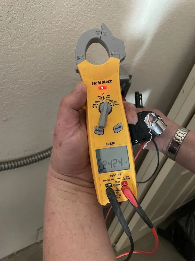 Voltage testing with clamp meter during Electrical Installation Services in Easton
